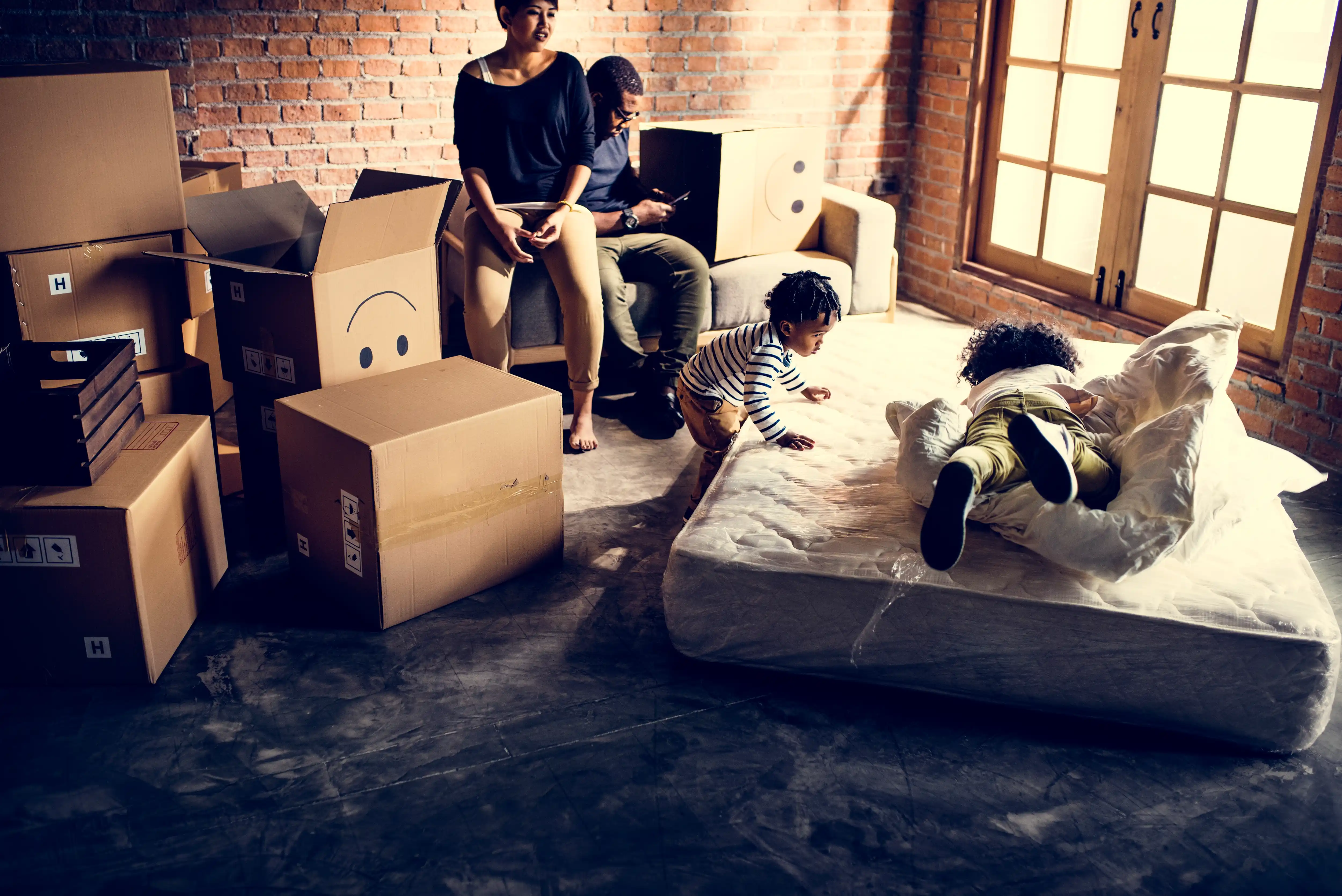 african family unpacking things after moving