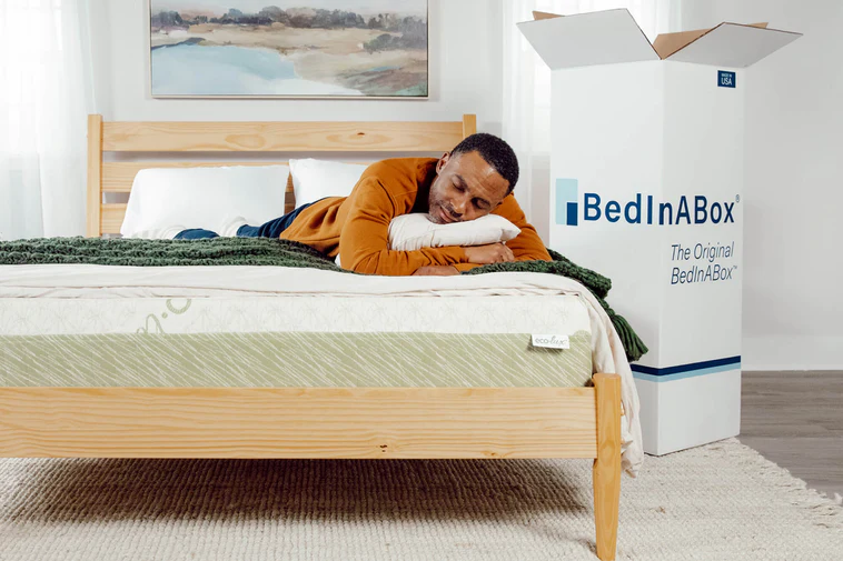 A reviewer sleeping on BedInABox Eco-Lux mattress