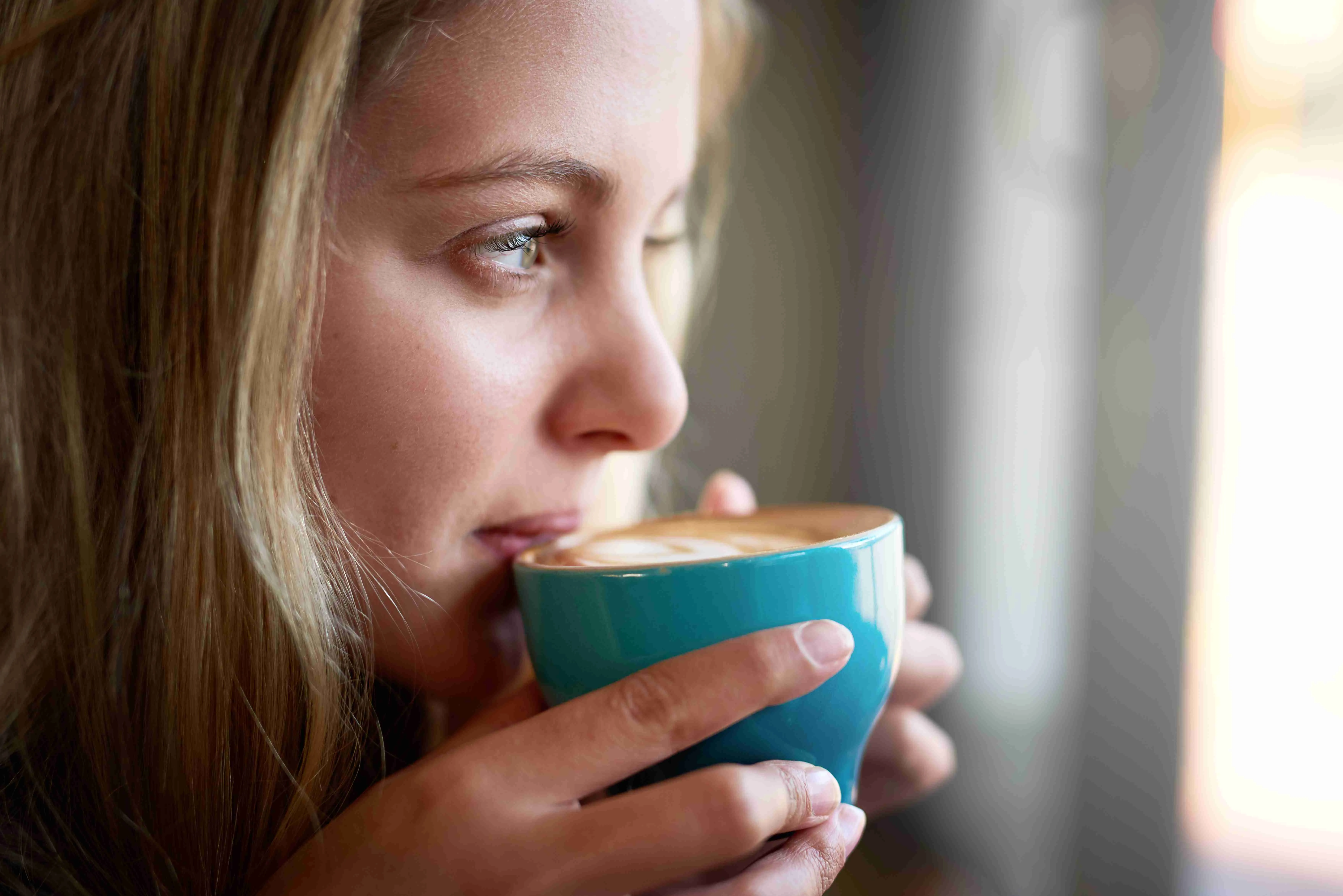 Pretty woman drinking coffee