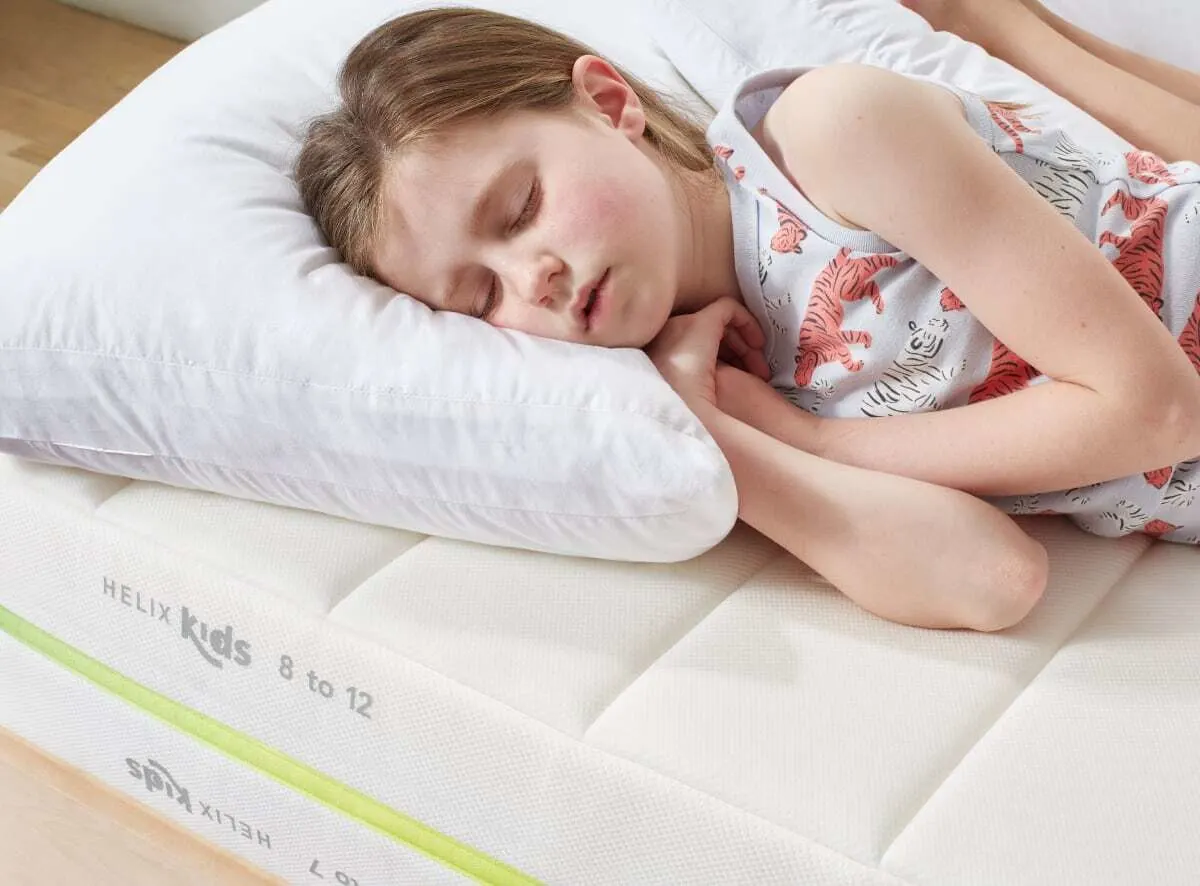 Kid sleeping on Helix Kids mattress
