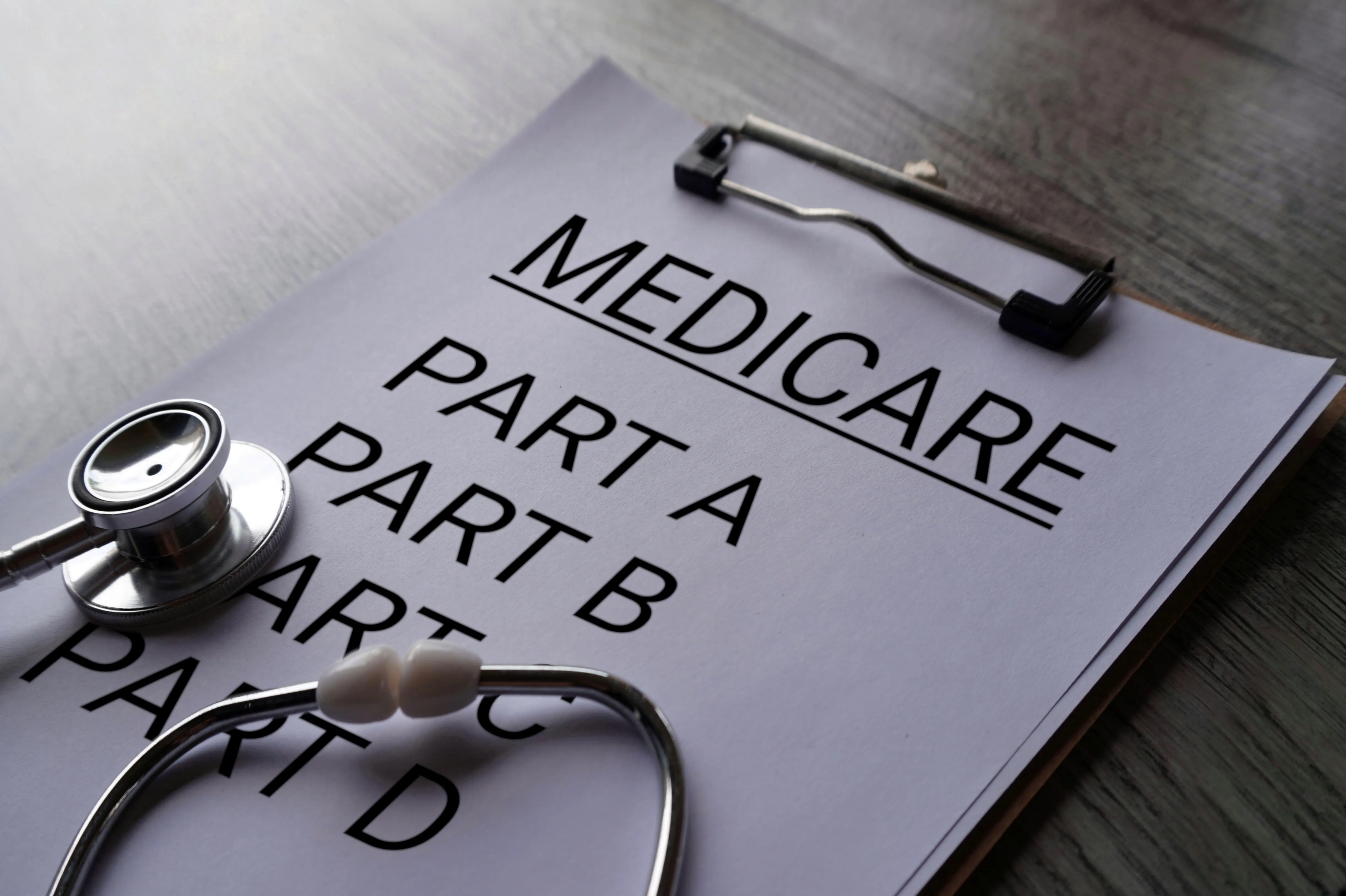 Stethoscope beside Medicare coverage paperwork