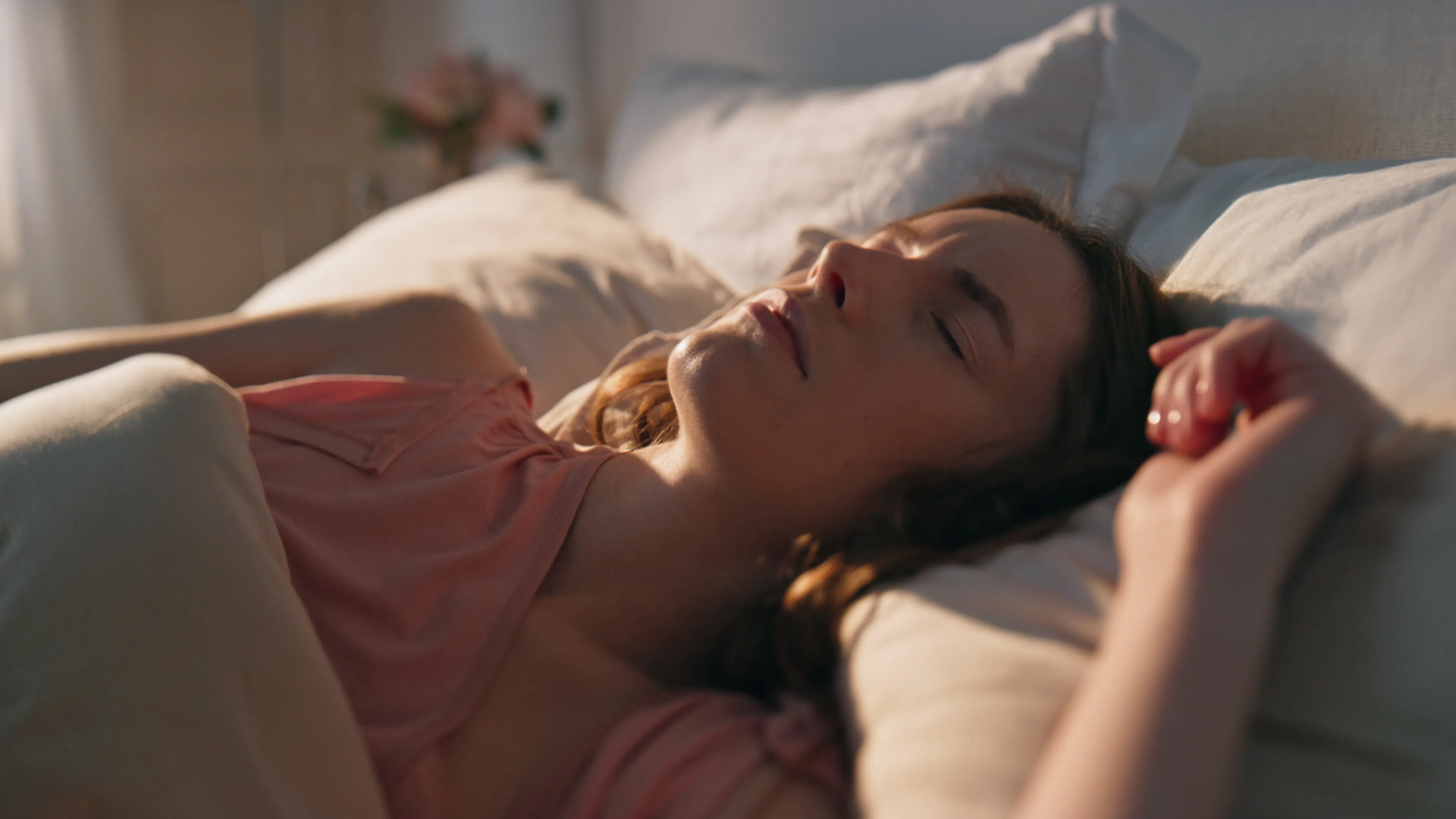 Peaceful young woman waking up