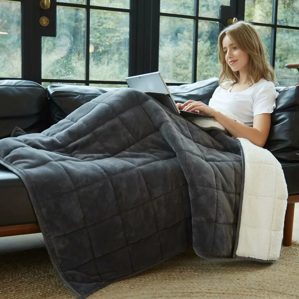 Girl Covered with Weighted Blanket and Putting a laptop on it