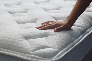 hand touching Leesa Sapira Chill mattress