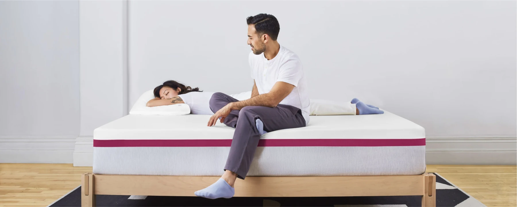 Two reviewers lying on Helix Dusk mattress