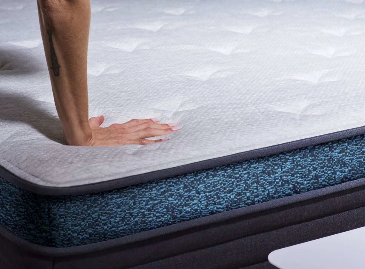 hands touching Helix Moonlight Luxe mattress