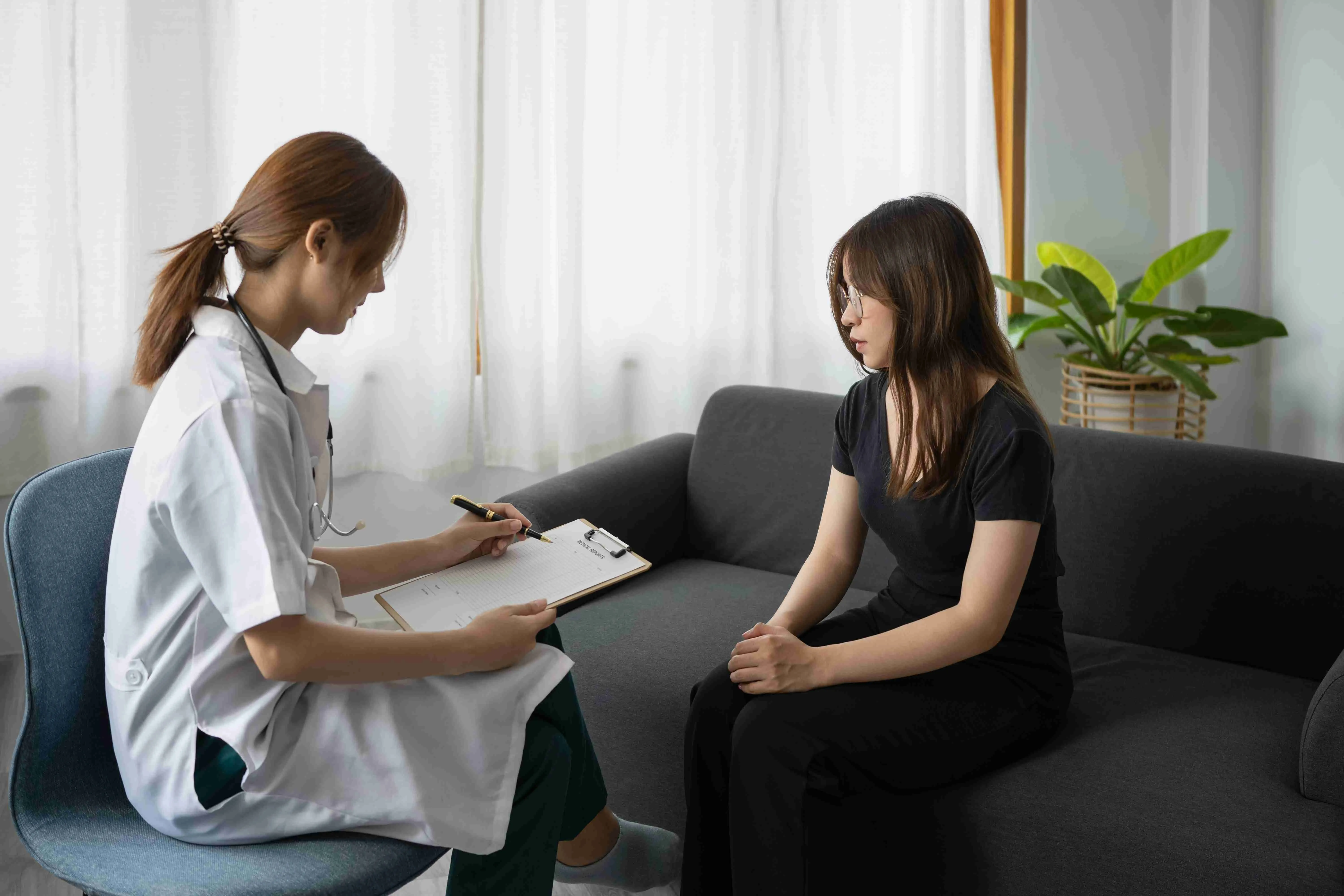 Female psychologist giving advice to patient