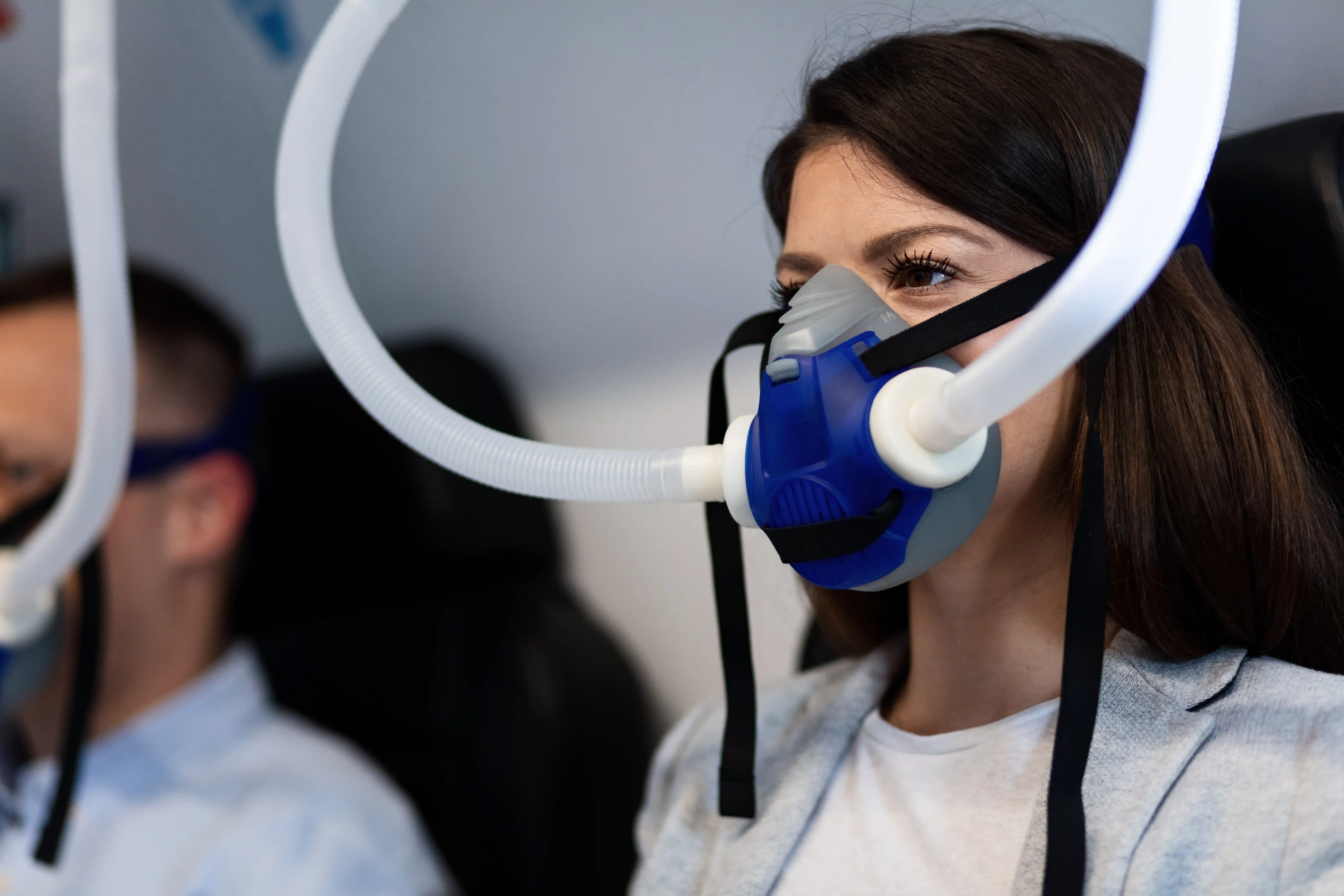 Patient wearing an oxygen mask while receiving hospital care