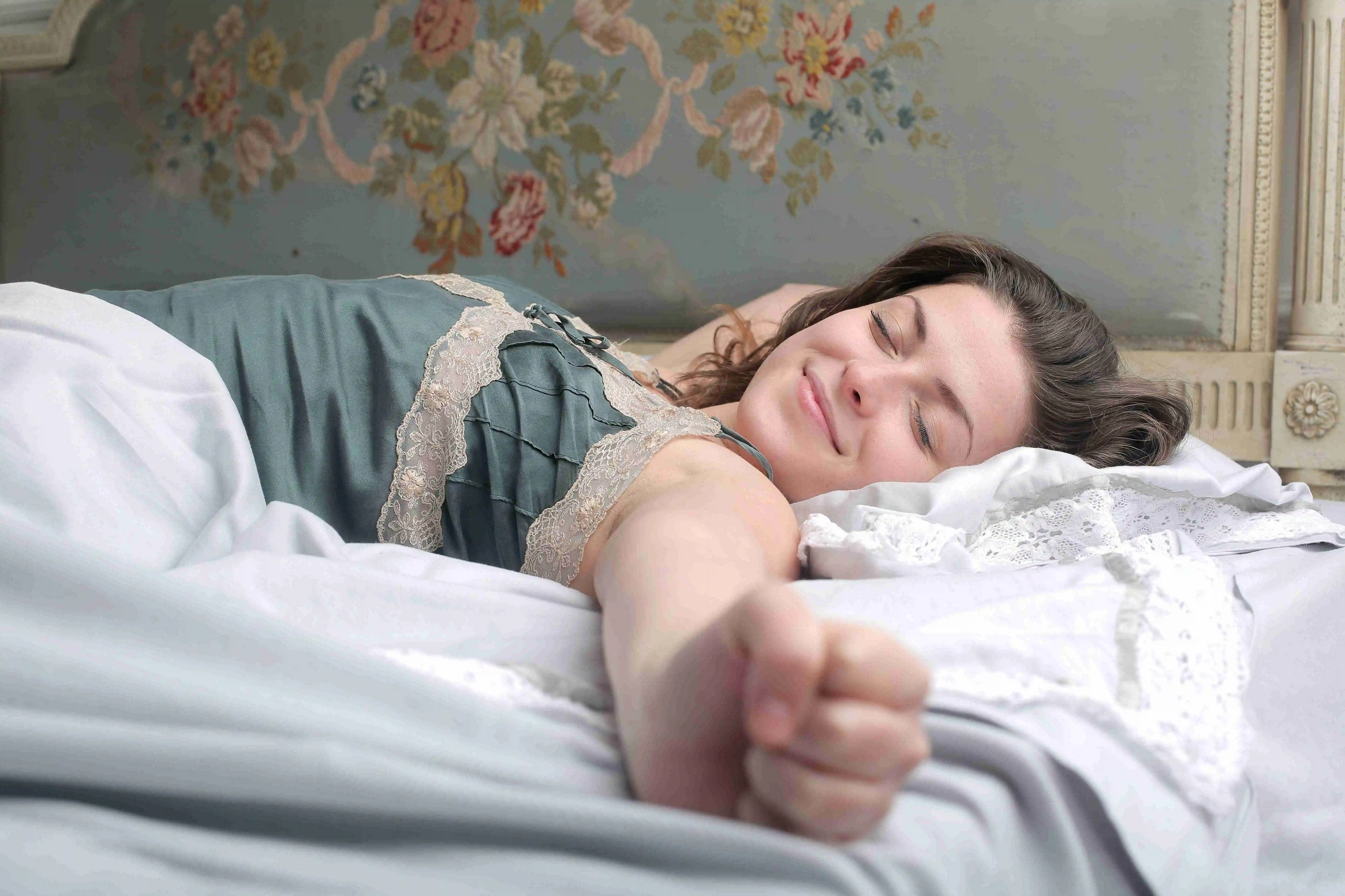 Young female sleeping peacefully in the bed in the morning