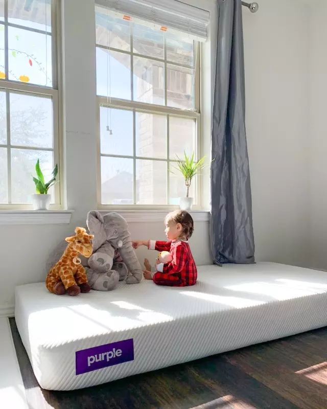 kid playing on Kids Purple mattress
