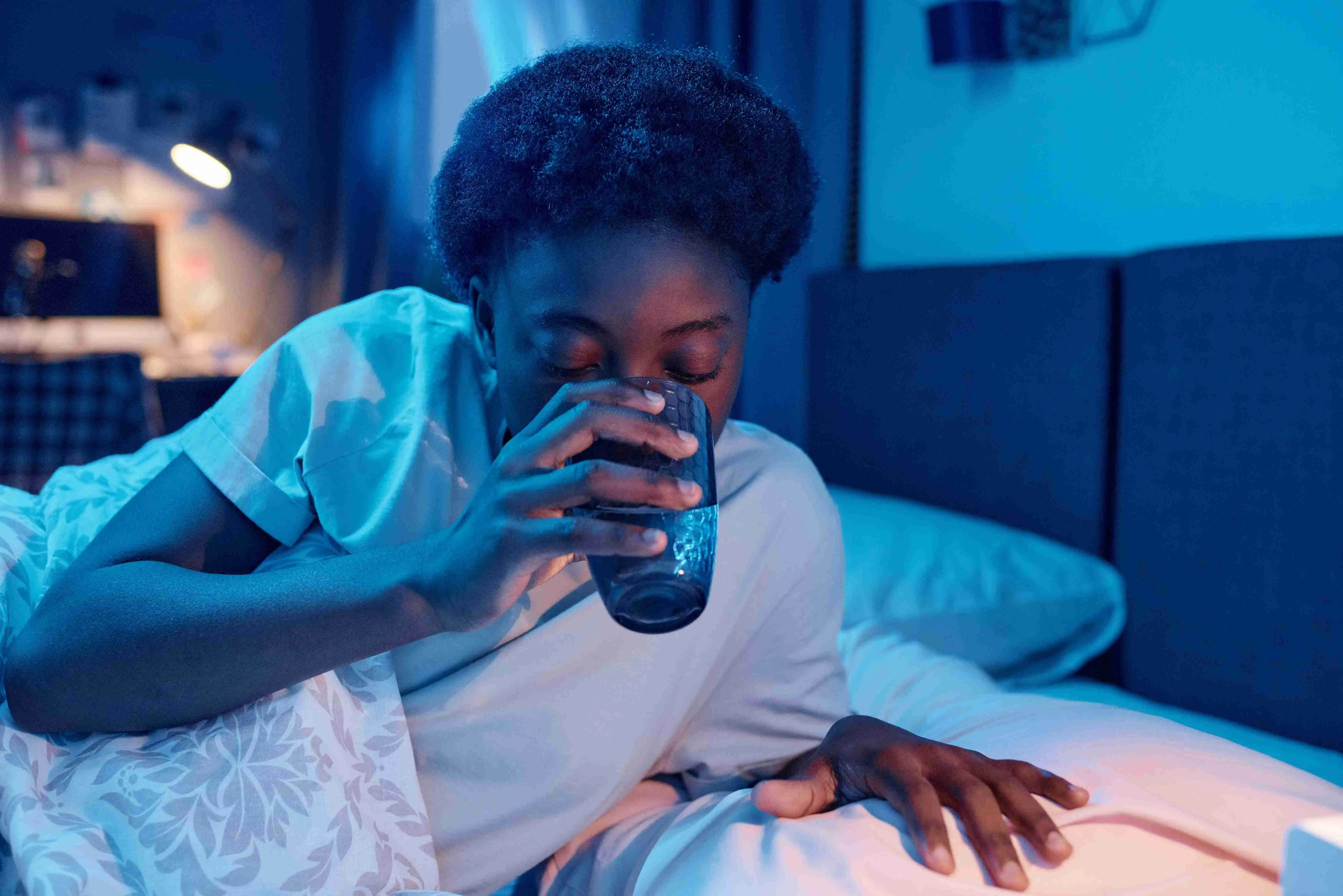 Woman drinking before sleeping