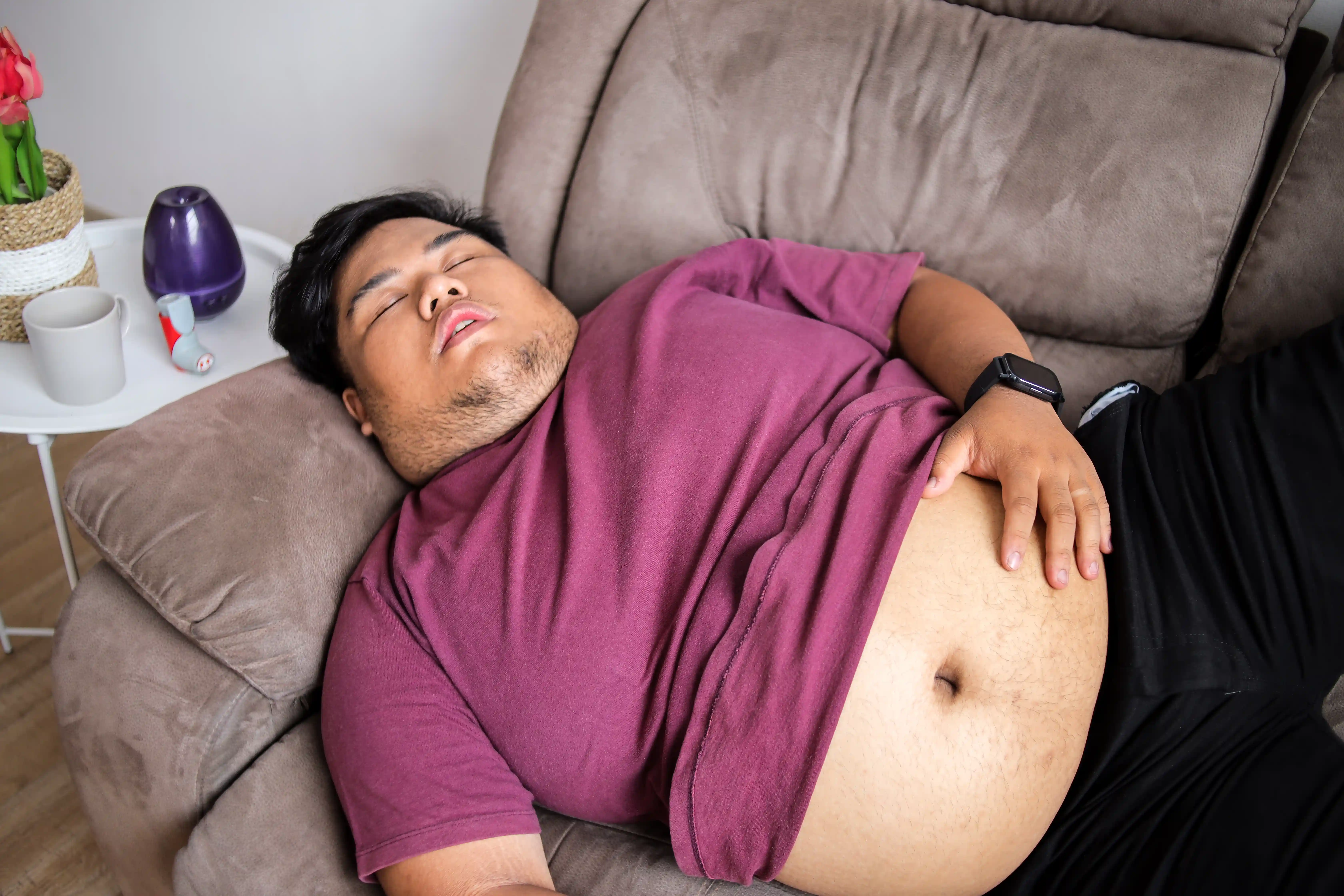 Man Relaxing on Couch in Home Interior