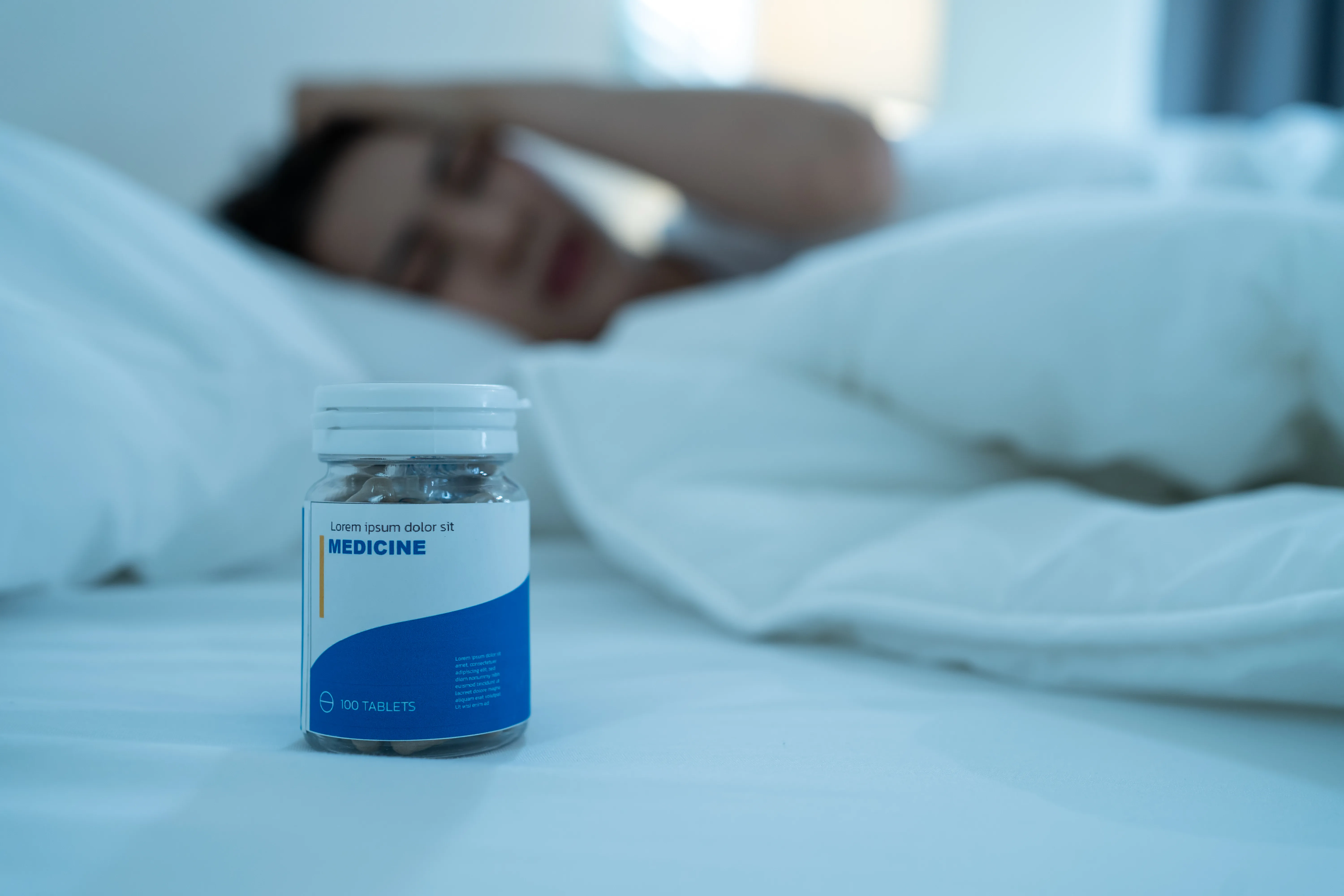 Medication bottle on a bedside table