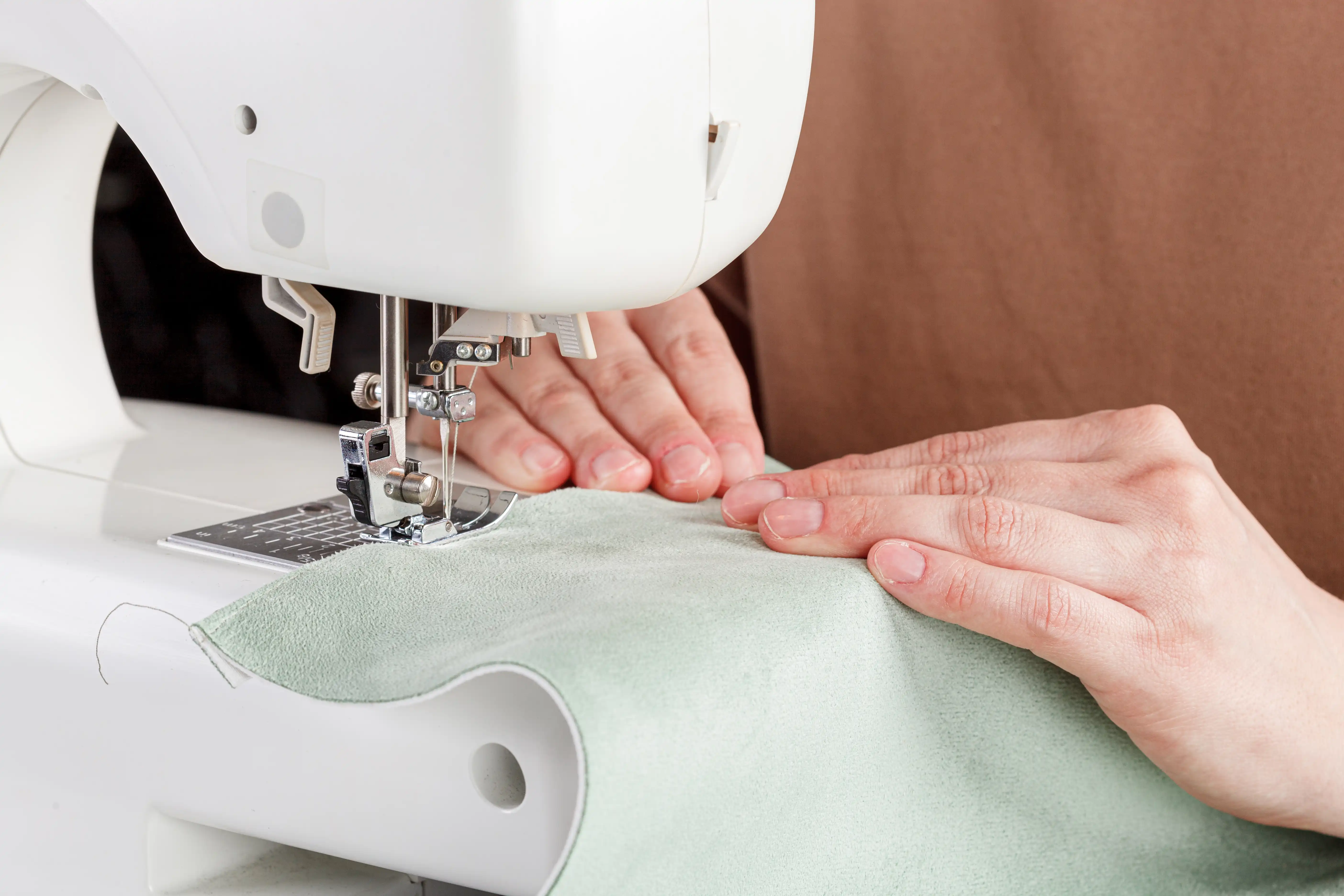 Sewing machine, stitching fabrics, needle in a round plan