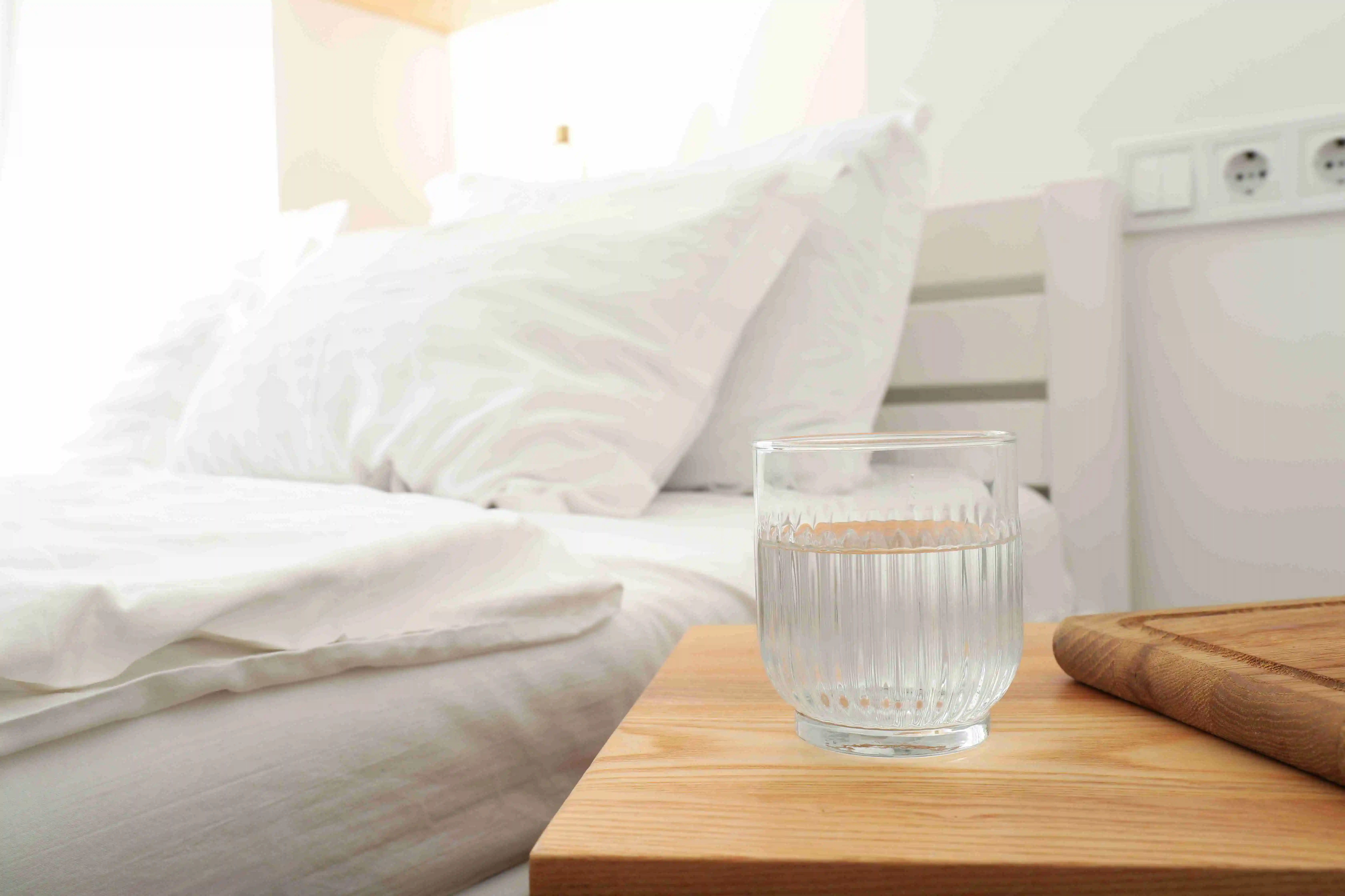 Glasses of water on a wooden board