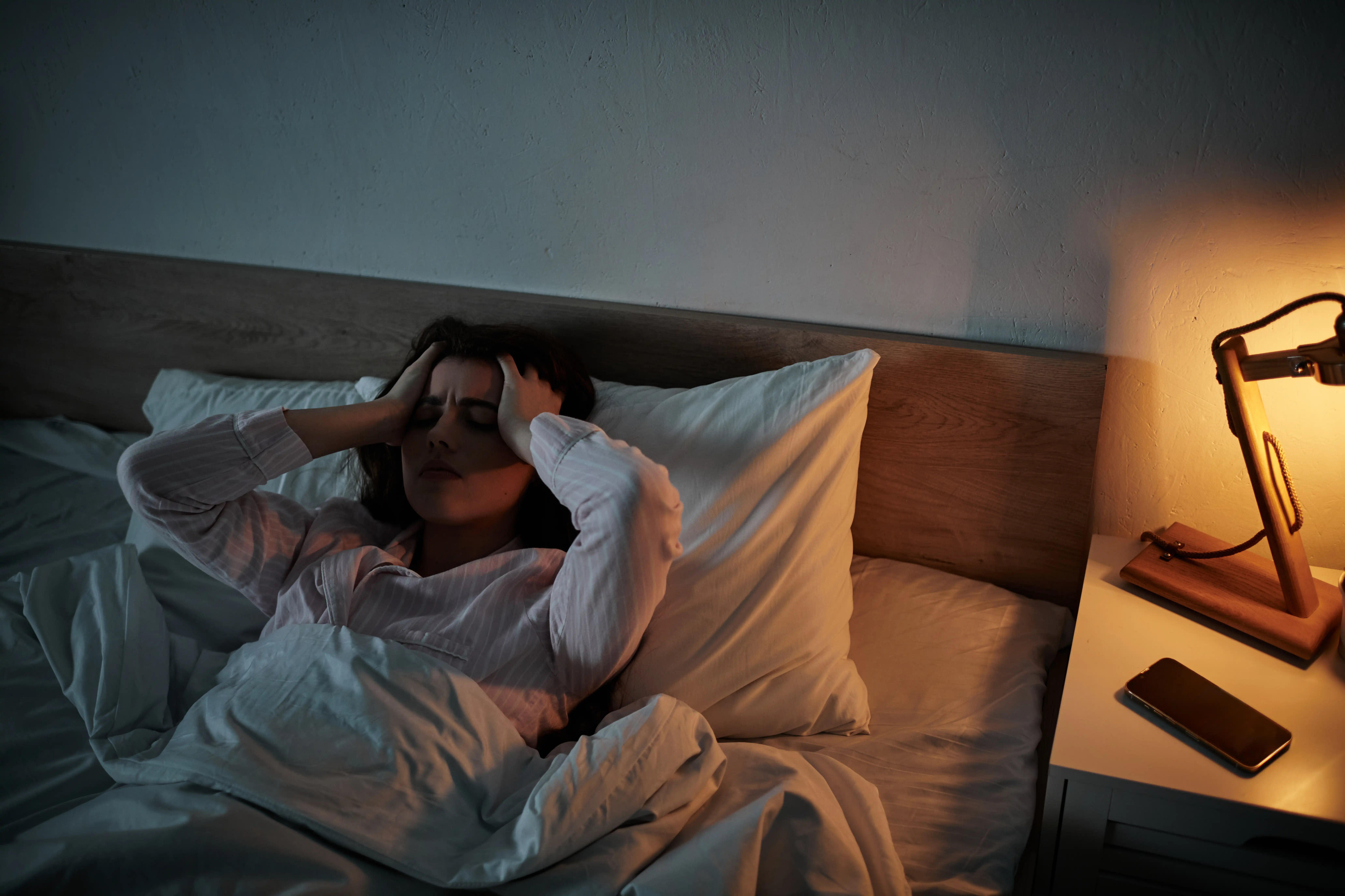 Woman lying awake in bed