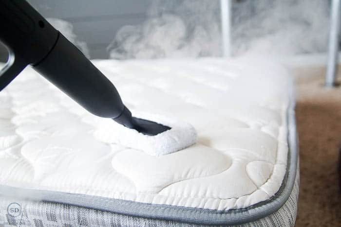 steaming cleaning a mattress