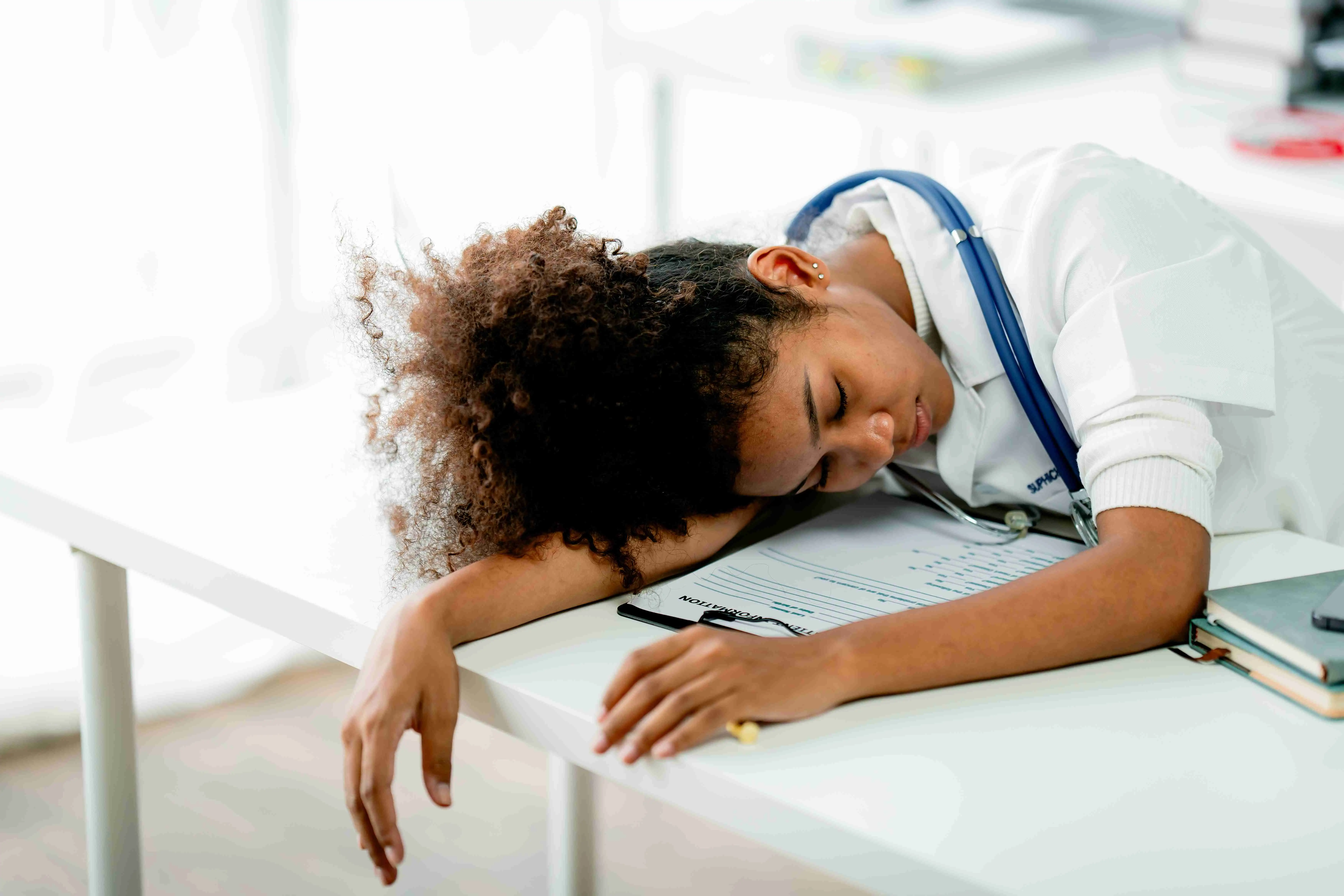 Tired African American female doctor Stress, anxiety, and sleepiness from working hard