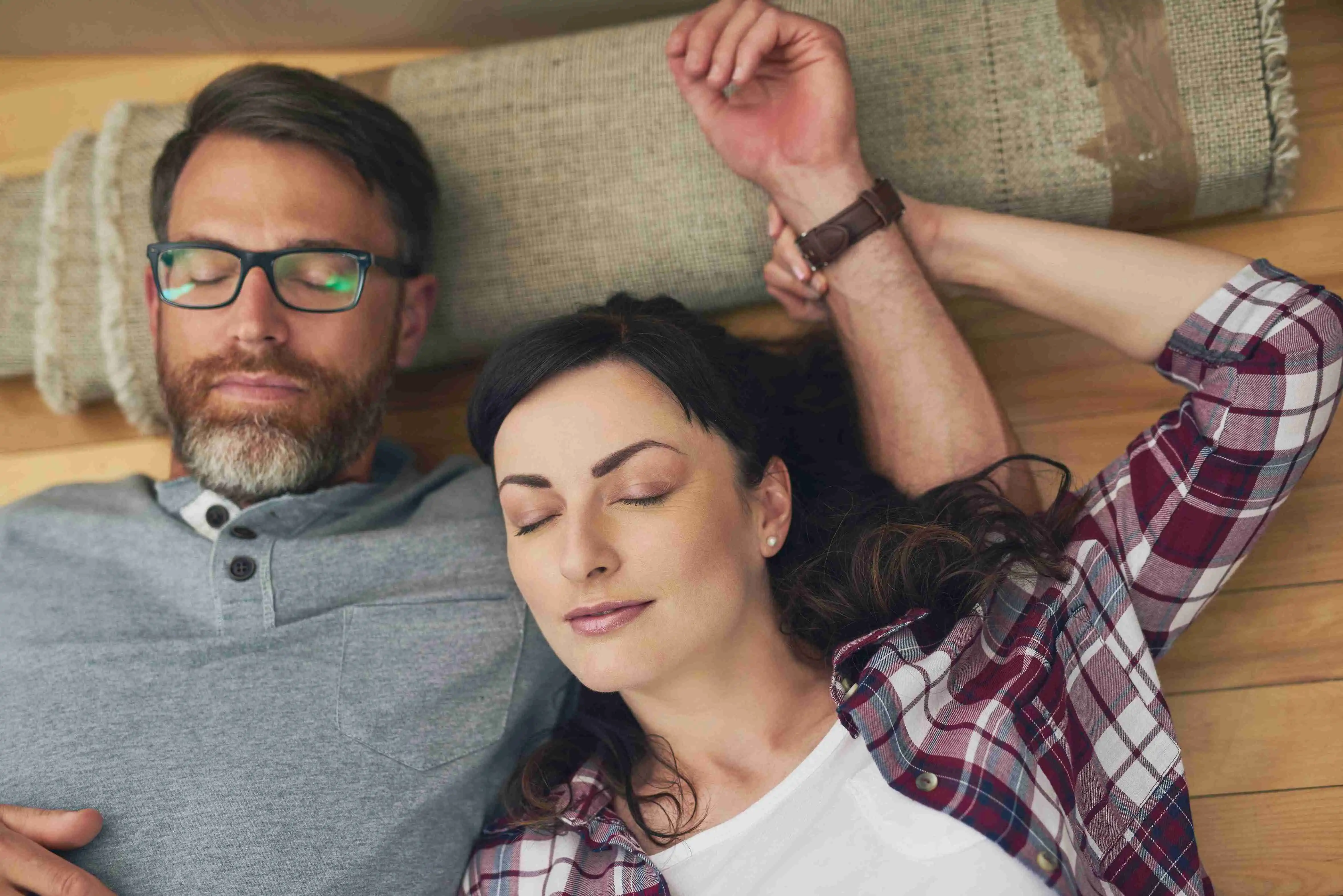 High angle shot of a couple taking a nap together on moving day