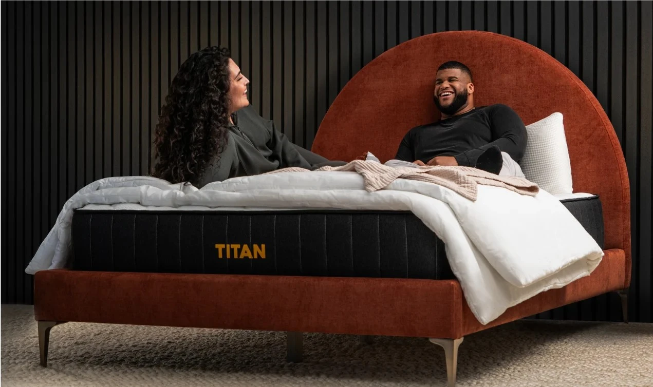 two reviewers laying on Titan Plus mattress