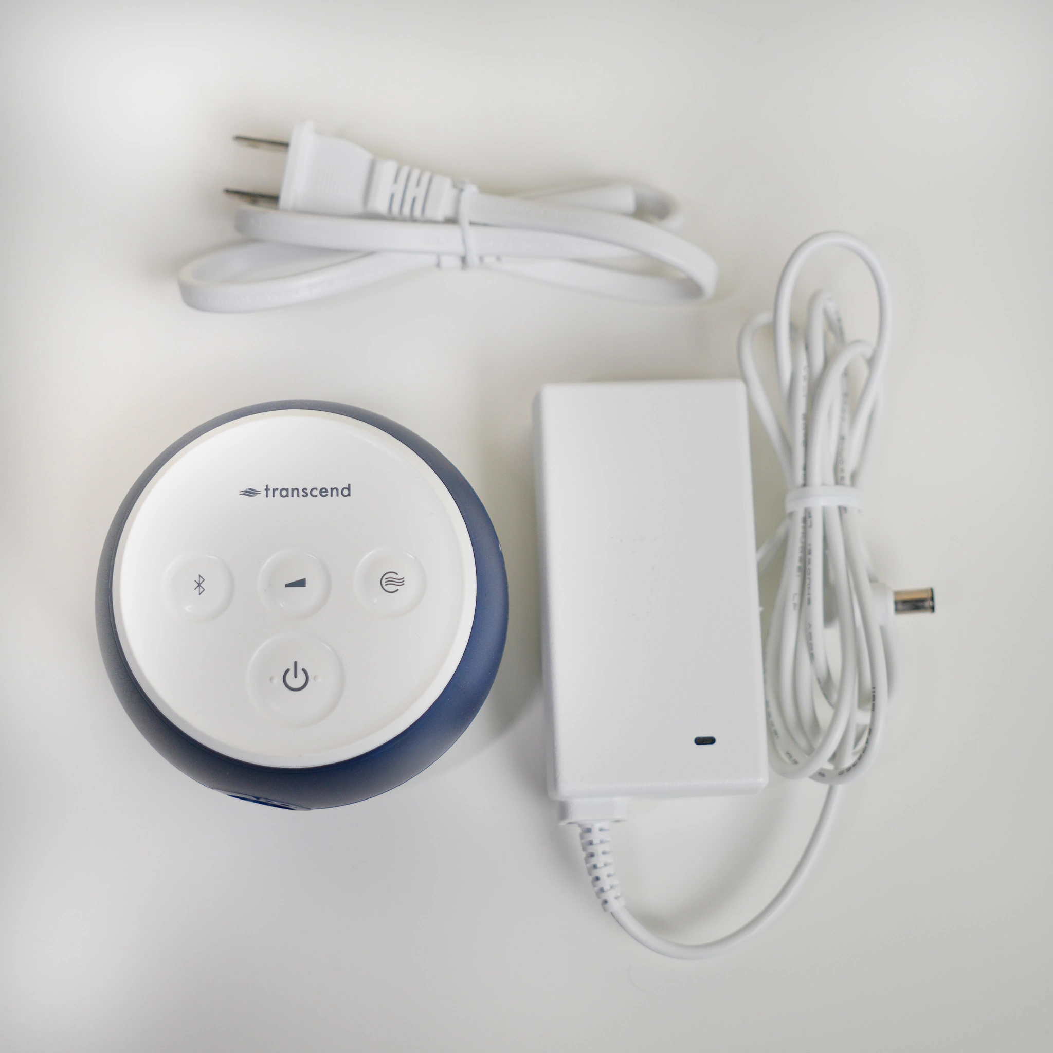Our Micro 510 beside its dedicated power adapter and cables.
