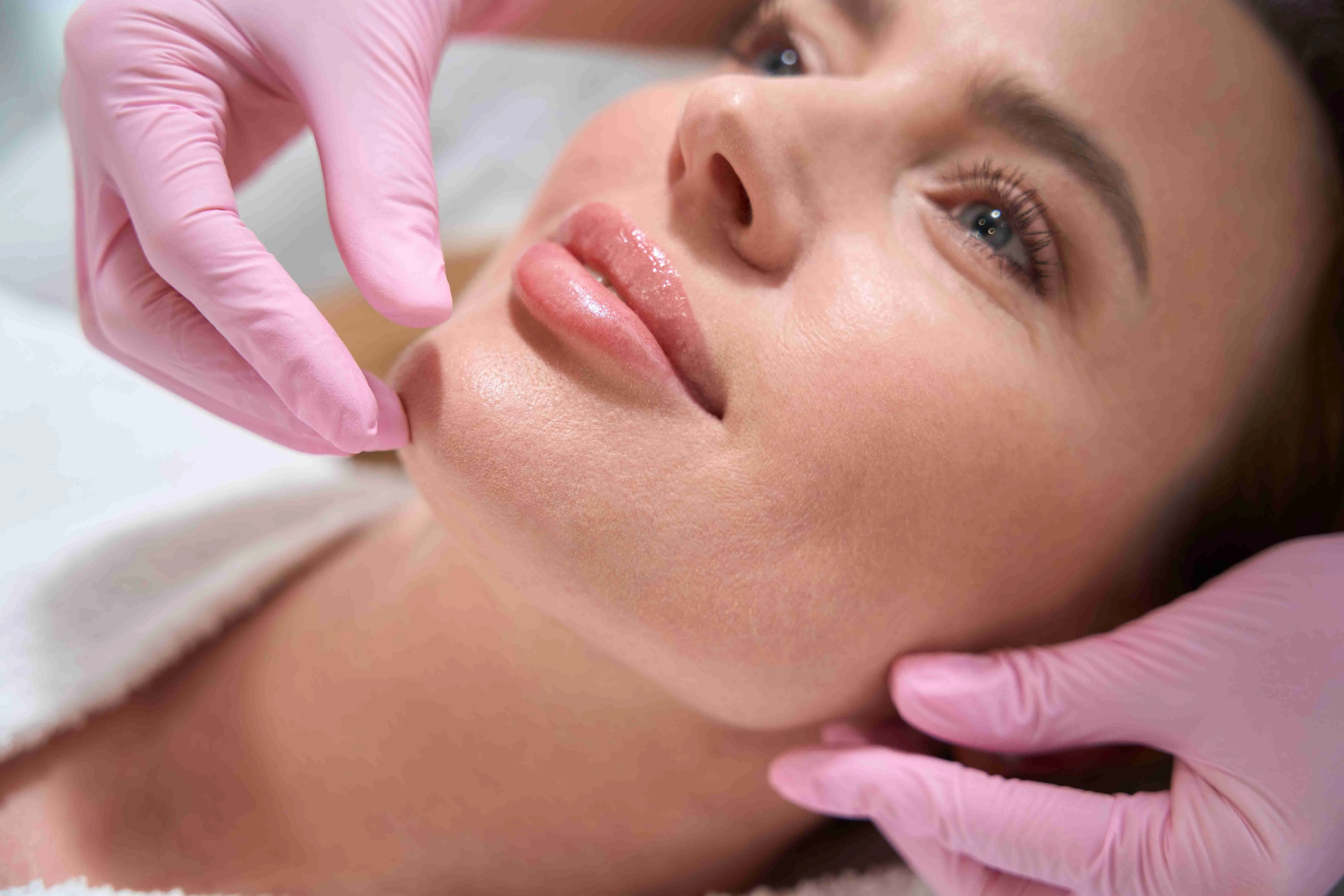 Charming female on a consultation in a cosmetology clinic