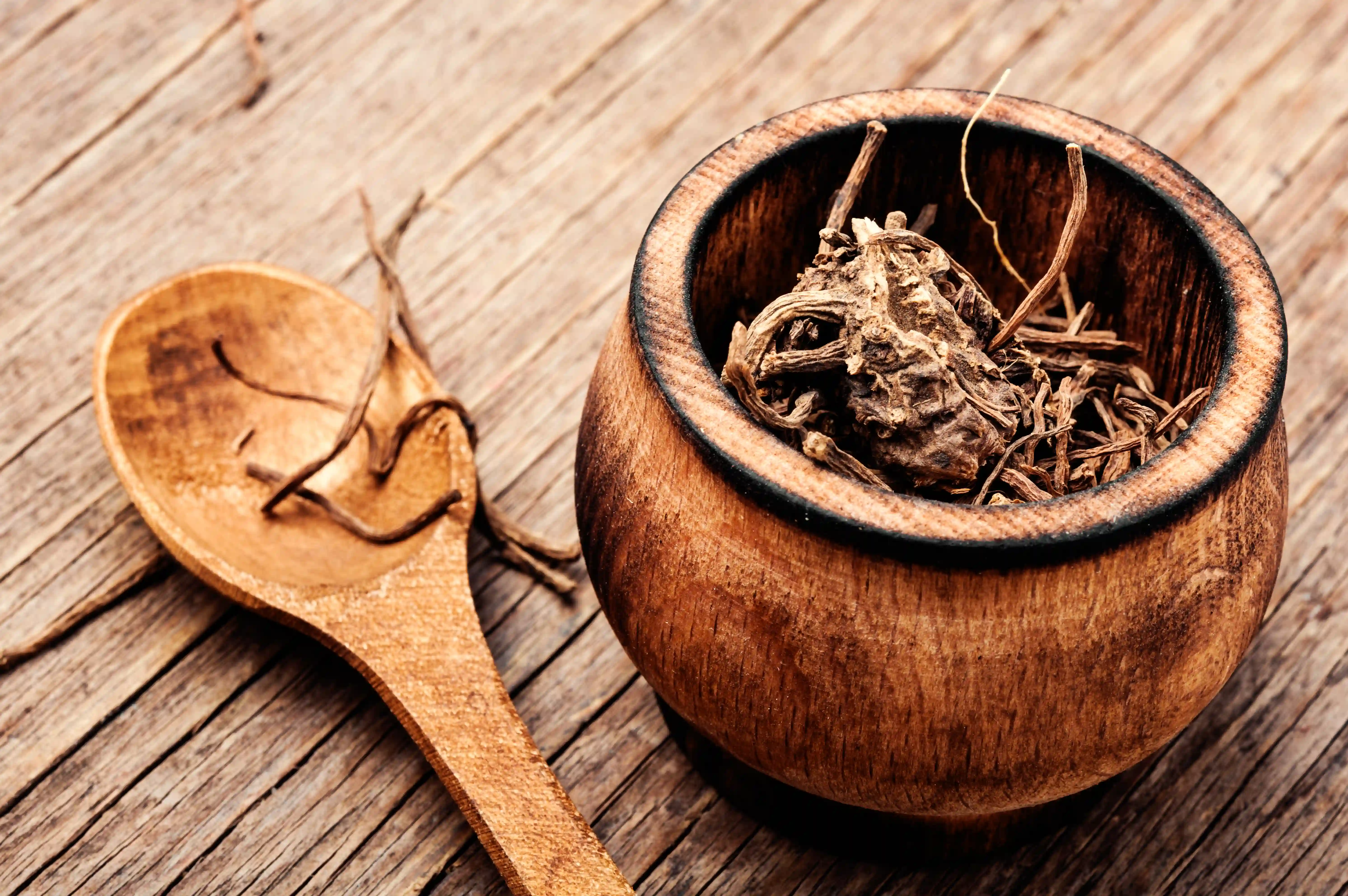 Dried Valerian Roots On Wooden Background.Valeriana Officinalis