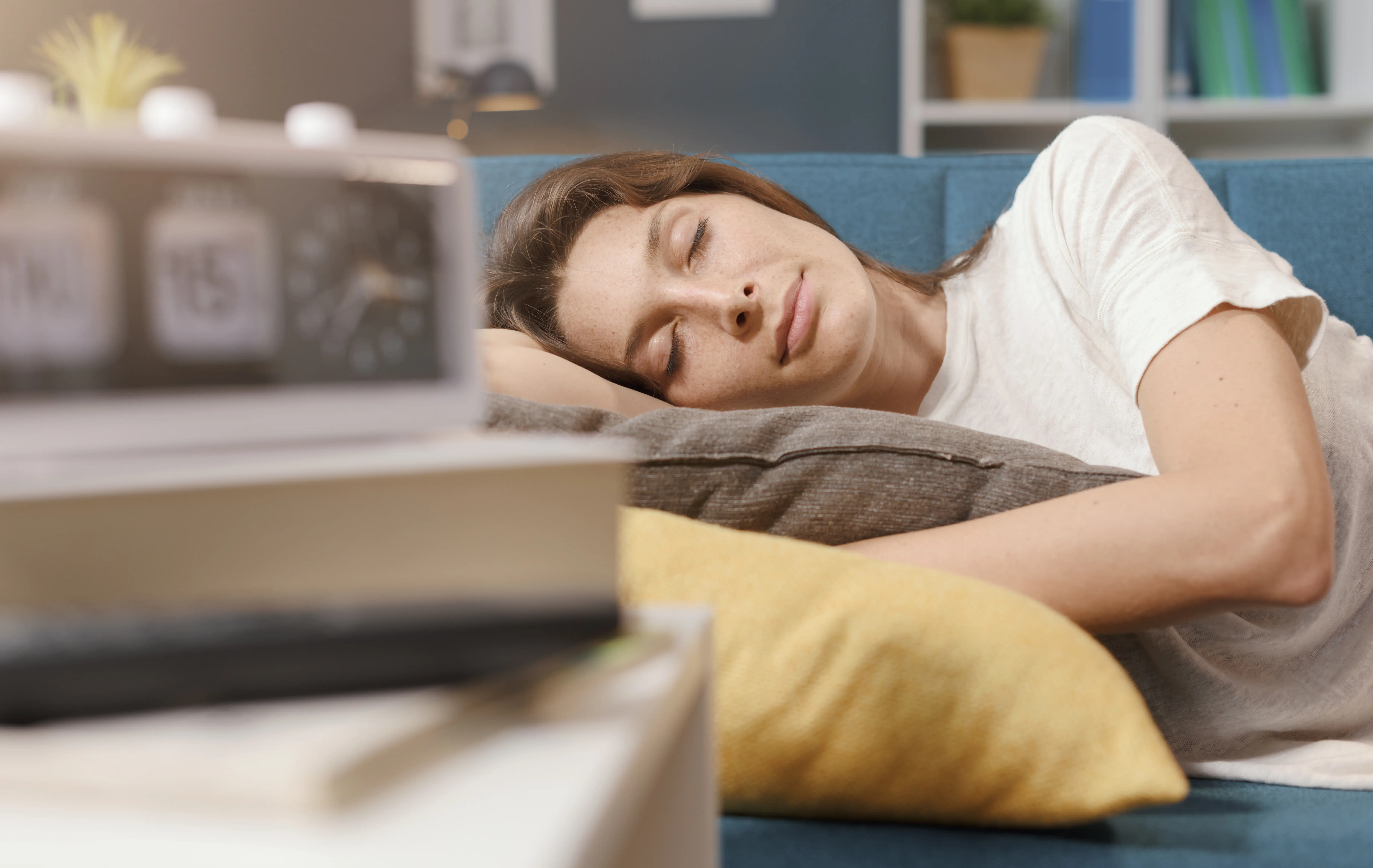 Relaxed woman sleeping on the sofa at home