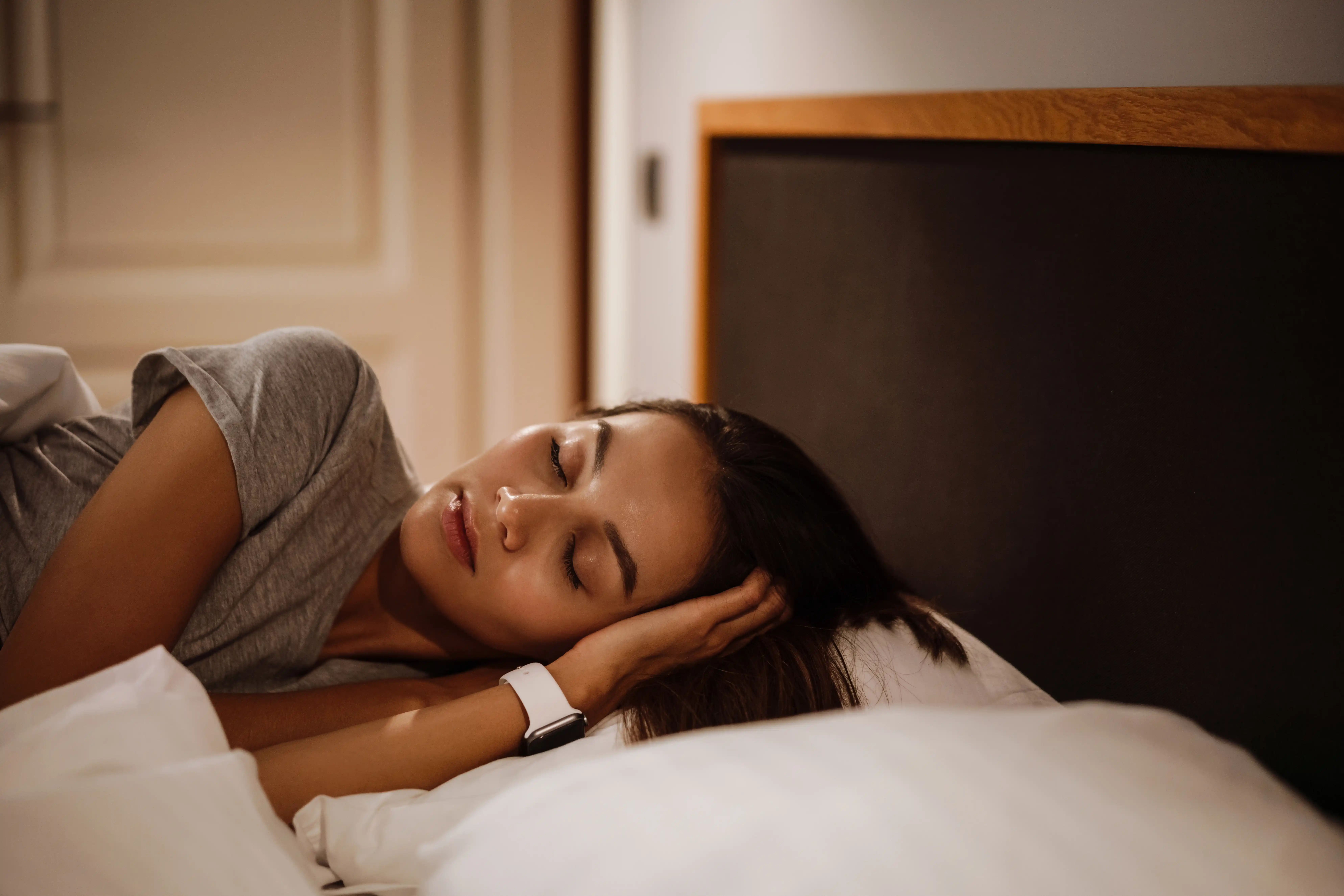 Brunette beautiful caucasian woman sleeping in bed at home