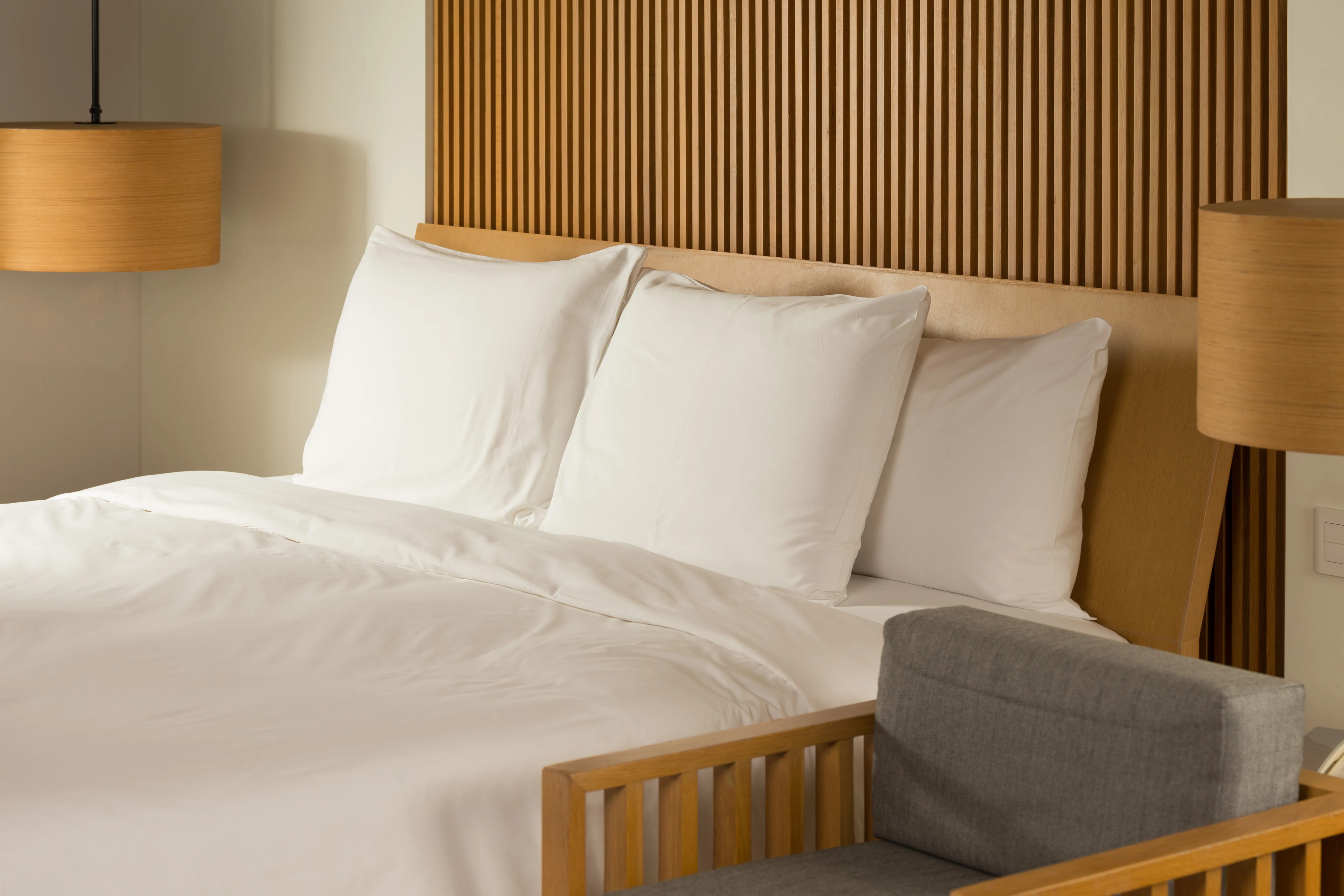 Elegant hotel room with a cozy, well-made bed
